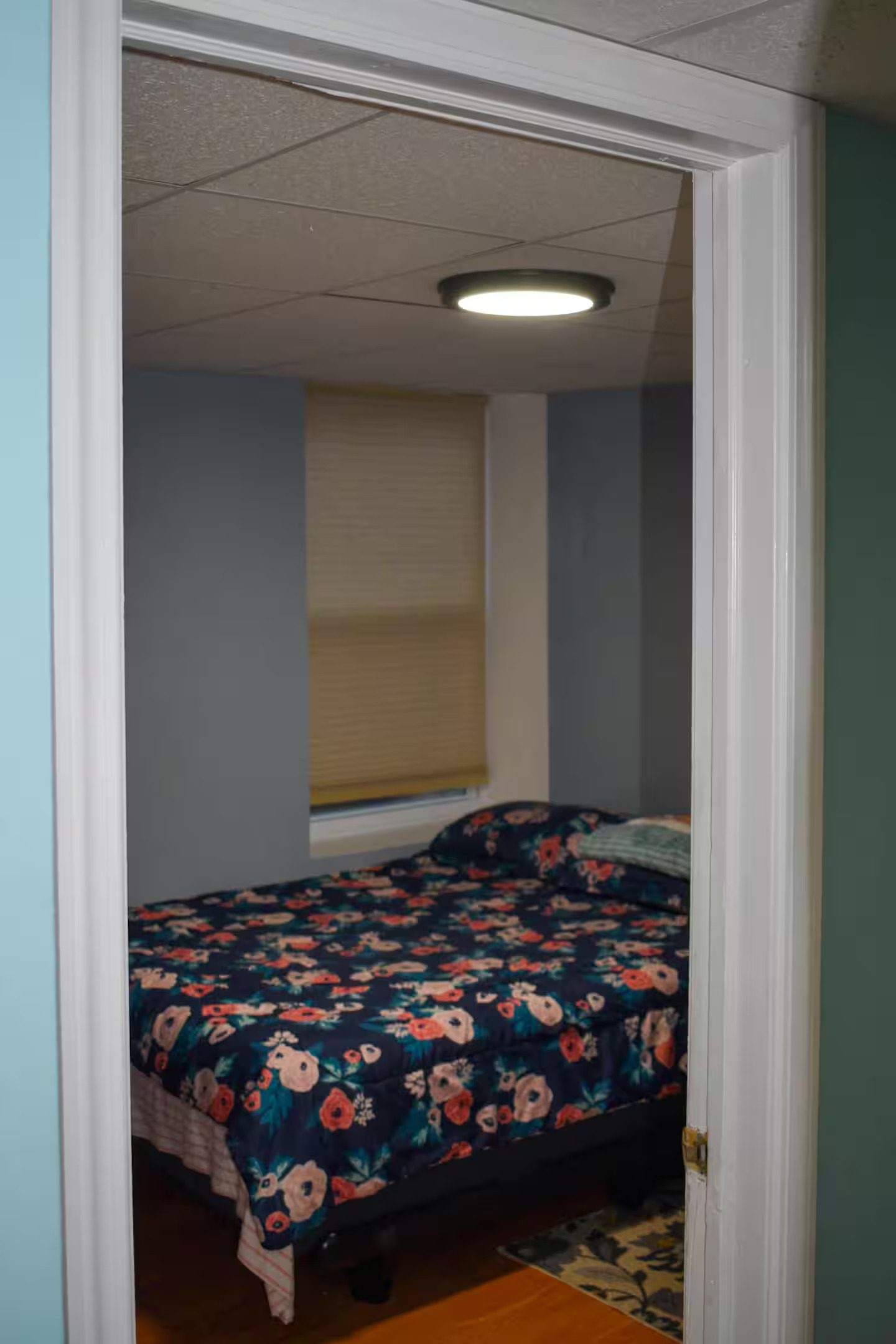 Small Room in the basement apartment with a cozy bed